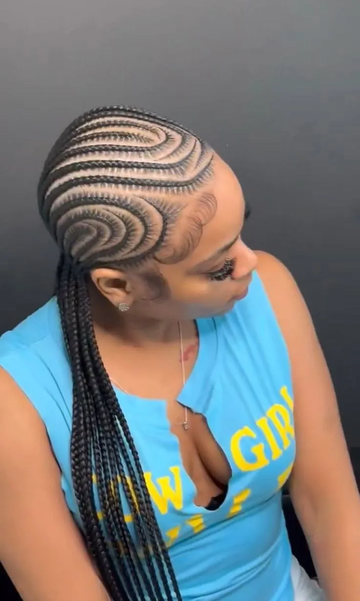 Woman wearing intricate feed-in cornrows at SS Braids salon in Accra