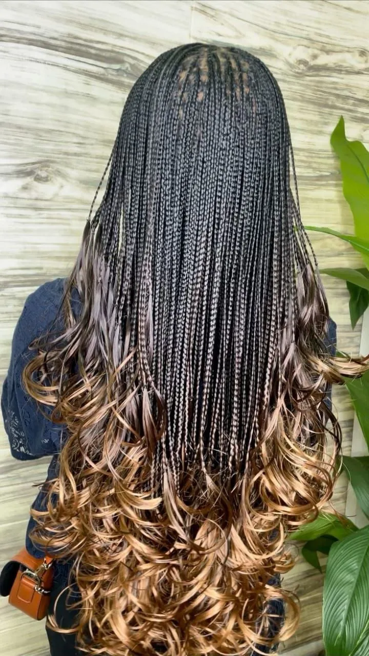 Knotless braids transitioning into voluminous bouncy French curl ends — photo 2 at SS BRAIDS GH Accra