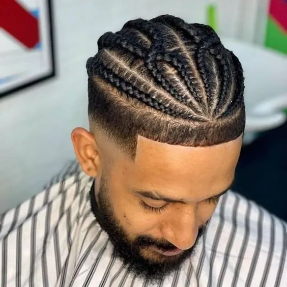 Men's top-knot braids above a taper fade at SS BRAIDS GH Accra - SS BRAIDS GH (ssbraidsgh) Accra