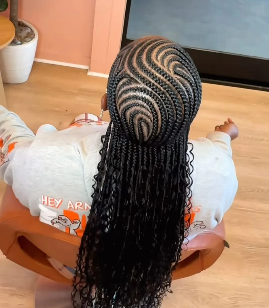 Woman wearing intricate feed-in cornrows at SS Braids salon in Accra — photo 2 at SS BRAIDS GH Accra