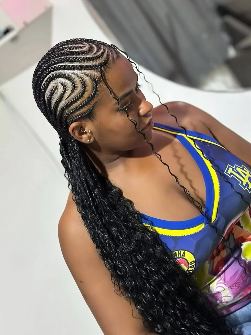 Woman wearing intricate feed-in cornrows at SS Braids salon in Accra — photo 3 at SS BRAIDS GH Accra