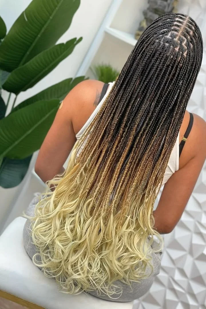 Knotless braids transitioning into voluminous bouncy French curl ends — photo 4 at SS BRAIDS GH Accra